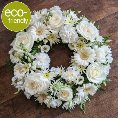 Eco-Funeral Wreath Ivory - A traditional ring-shaped funeral tribute, <b>beautifully arranged in biodegradable floral foam</b>. Your tribute can be made in <b>your choice of colours</b> and <b>suitable for a lady or gentleman</b>.