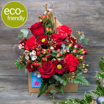Sending Christmas Wishes Envelope Arrangement | Floral Box Darlington - A unique festive gift. Our Christmas Envelope Arrangement features red roses and winter berries in a kraft box. Hand-crafted in Darlington.